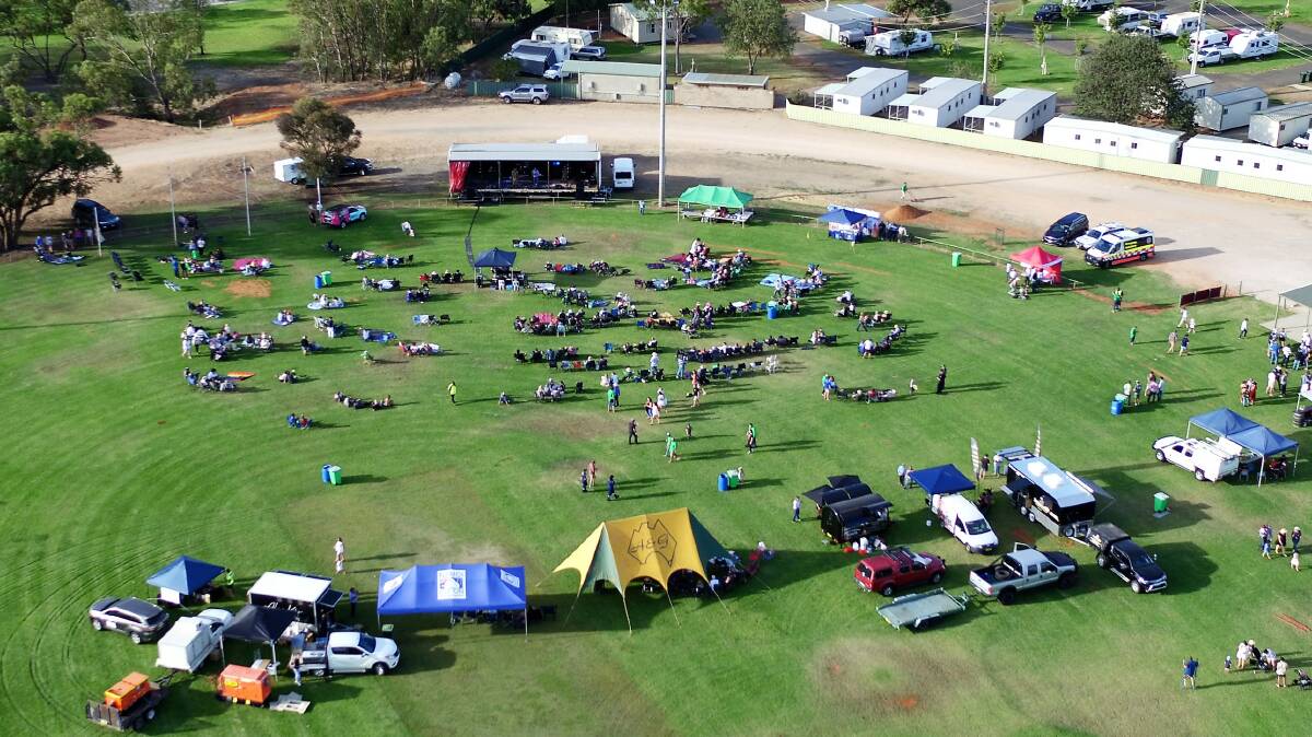 VIEW FROM ABOVE: The crowd arrives at Stan Peters Oval on Saturday afternoon; by nightfall there was only standing room left. PHOTO: Justin Southern