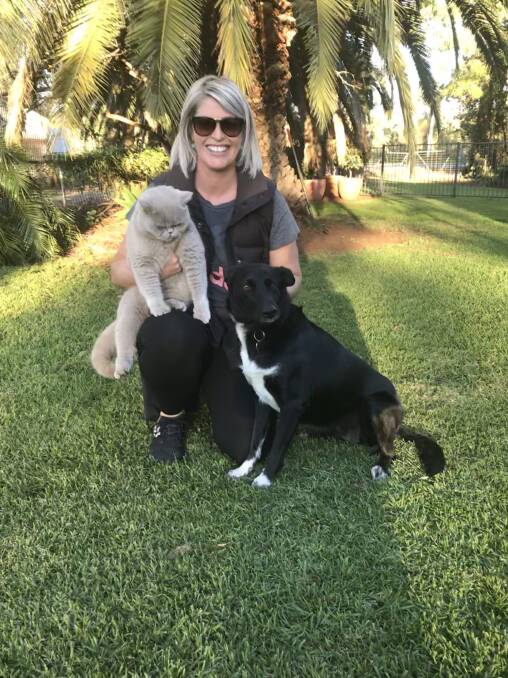 DESEXING DRIVE: Friends of Griffith Pound member Rachel Carlon with her dog Jess, who was rescued through Needy Paws, and cat Puddy. PHOTO: Contributed