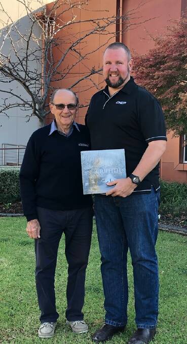 SECOND TIME AROUND: Bruno Guidolin accepts a copy of the Griffith Book from Deputy Mayor Doug Curran to give to the Pope in June, and looks forward to receiving His Holiness' blessing. PHOTO: Contributed