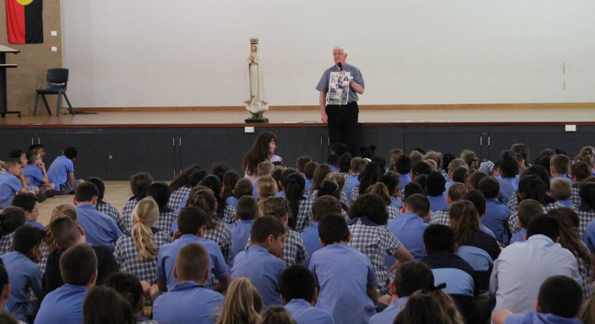 CENTENARY CELEBRATIONS: Father Gerard Ryan speaking to the students of Saint Mary's Primary School in celebration of the centenary of the apparition of The Lady of Fatima.