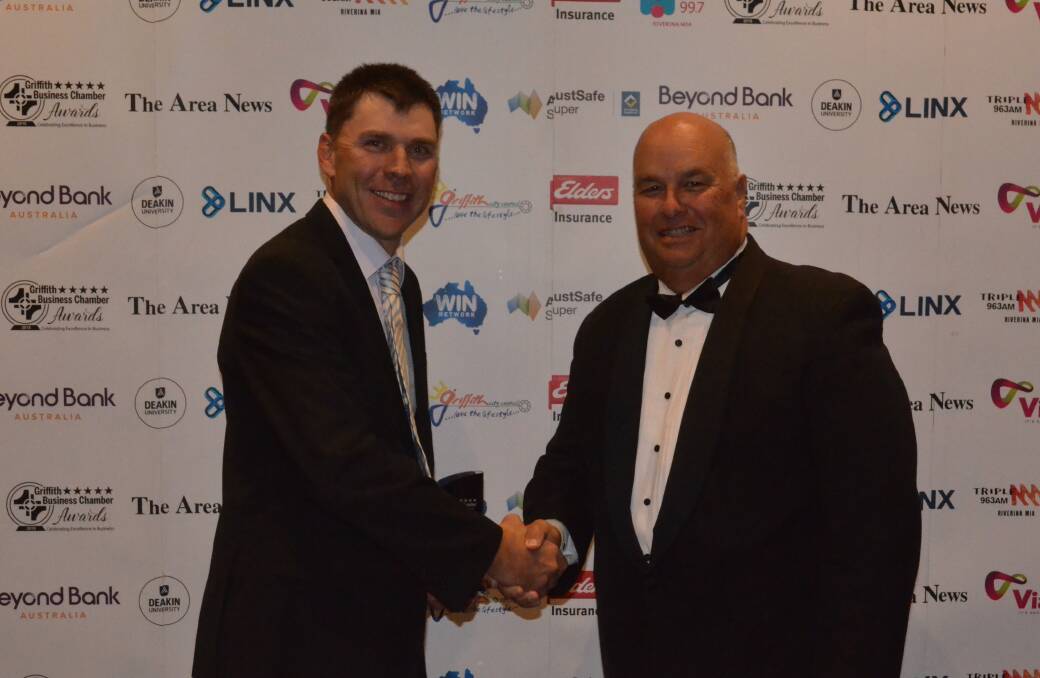 Excellence in Business: Winner Murray Cod Australia's representative Matthew Ryan with award sponsor from AusSafe Super presenter Michael Wynne.