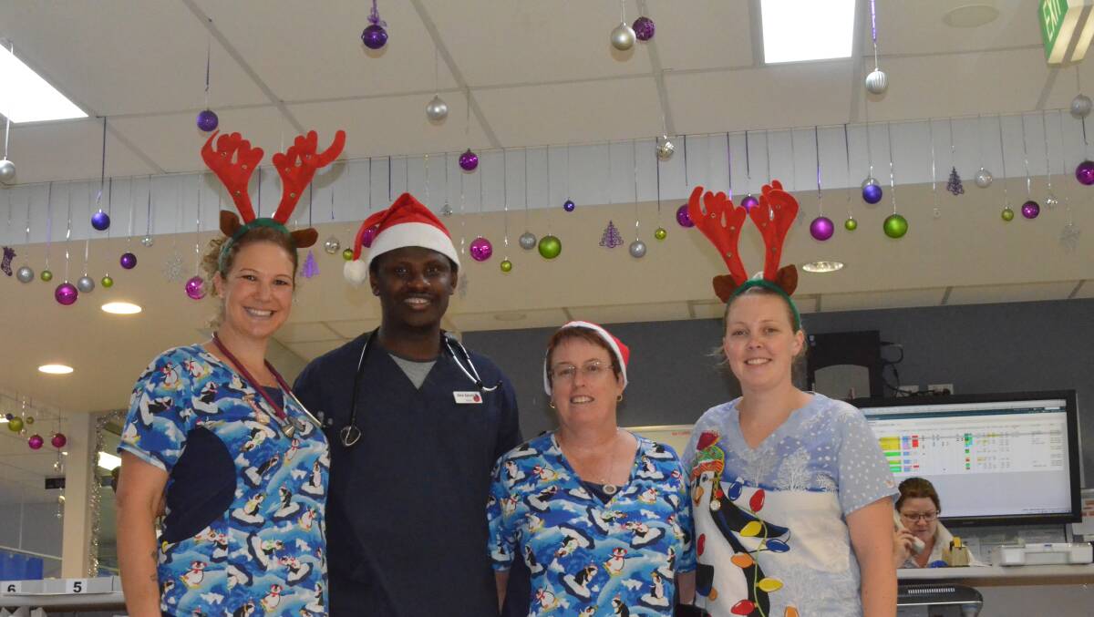 BAUBLES: Nurse practitioner Sandra Hungerford, Doctor Akin, nurse Helen See, Monique Hopwood, and unit manager Simone Hazelman from the Energency Department. PHOTO: Jacinta Dickins.