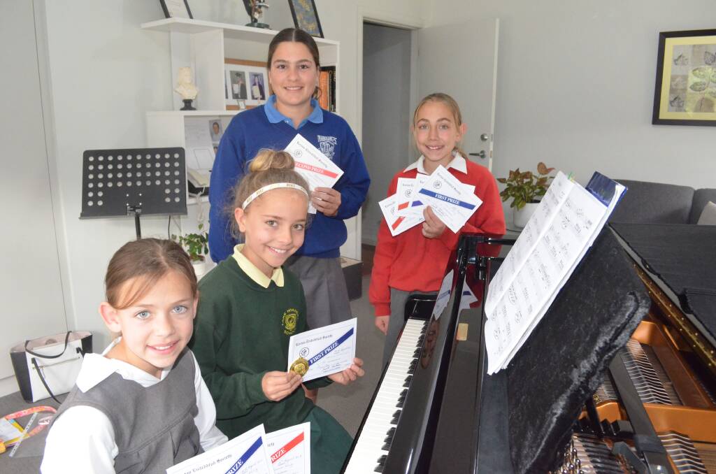 YOUNG TALENT: Pianists Allanna King, Serena O'Connor, Julia Sergi, Emma King and Bethany Piva (absent), students of piano teacher Mary Santos, came away with multiple wins at the recent Leeton Eisteddfod. PHOTO: Jacinta Dickins