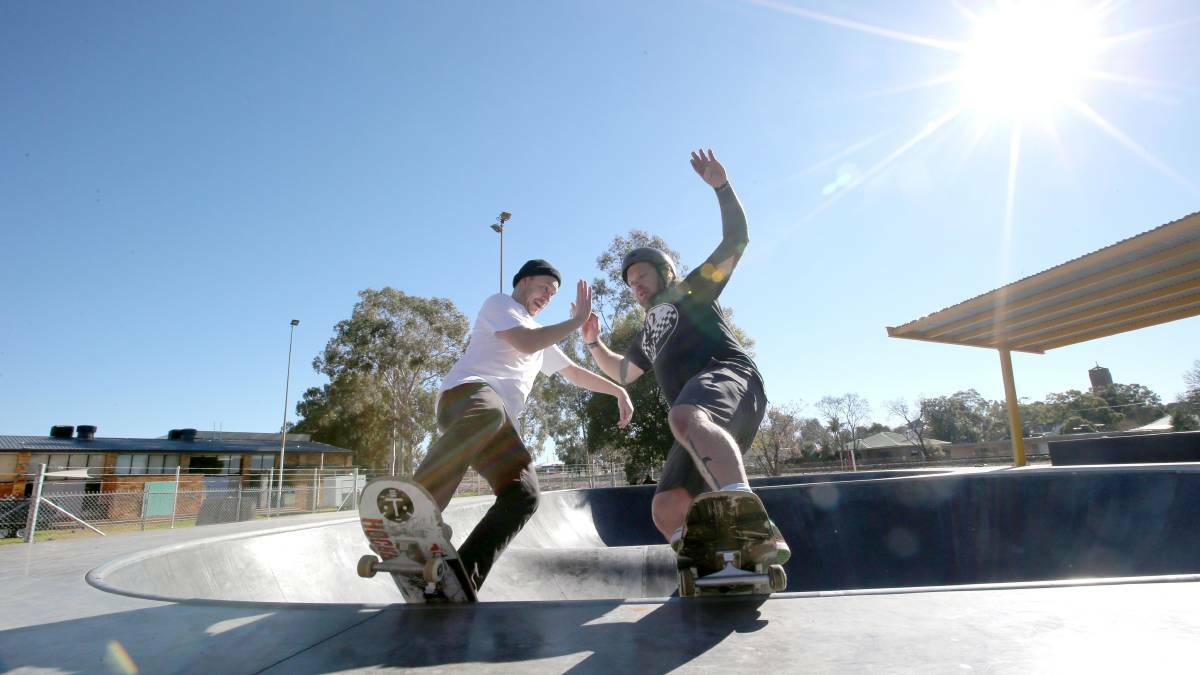 SKATER BOYS: Todd Tengstrom and Matt Spencer celebrating the opening of Griffith's new skate park. Picture: Anthony Stipo