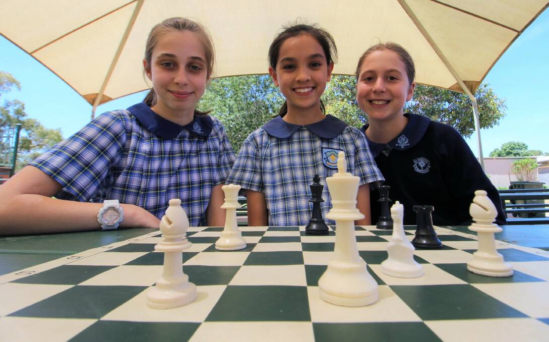 MATES: St Patrick's chess team Chloe Zamin, Shania Shipton and Anika Smith are off to the state championships. PHOTO: Jacinta Dickins
