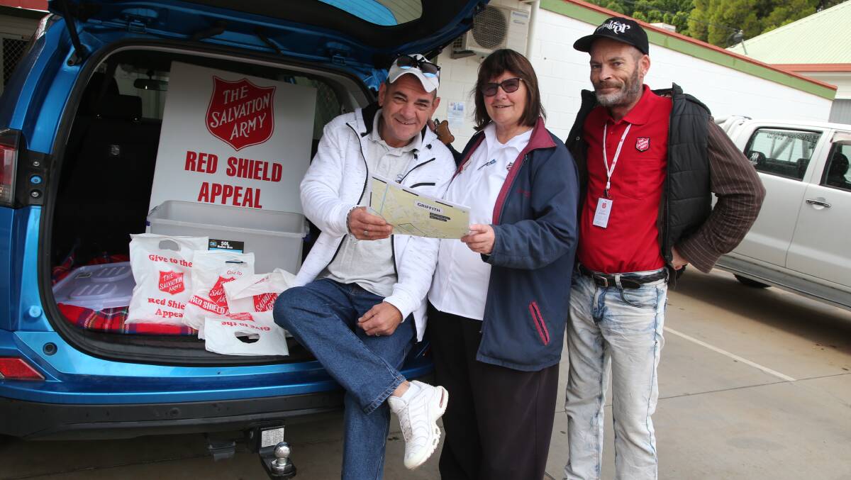 VOLUNTEERING: Shayne, Major Lyn Cathcart and Geoff Wright out collecting donations for the Red Shield Appeal. PHOTO: Anthony Stipo