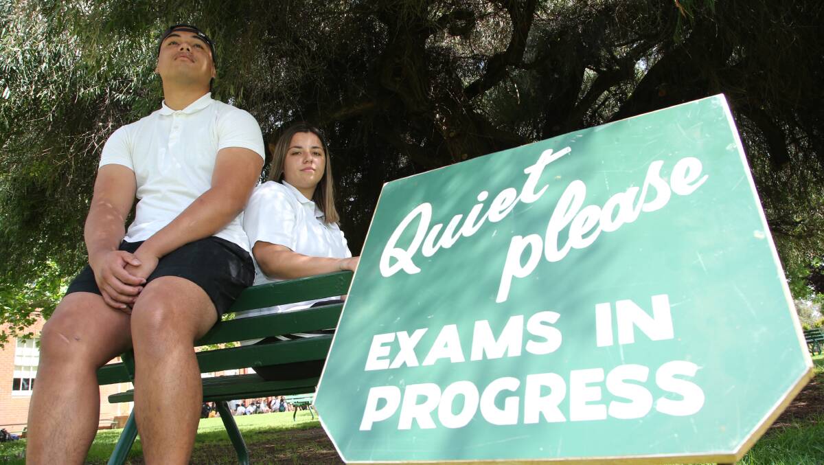 QUIET PLEASE: Year 12 students Griffith High School's Charlie Tiaina and Sineytah Monaghan are halfway through their exams. Picture: Anthony Stipo