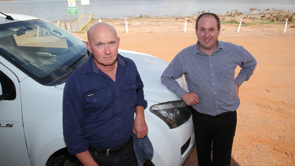 TEACHING PLAN: Lake Wyangan and Catchment Management Project Officer Tom Ryan with Greg Adamson, byelection candidate. Picture: Anthony Stipo