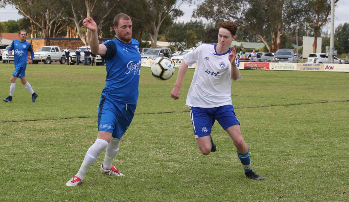 KEEPING MOMENTUM: Hanwood FC's Daniel Johnson in the Pascoe Cup match on their home ground against Tolland on Sunday. PHOTO: Anthony Stipo