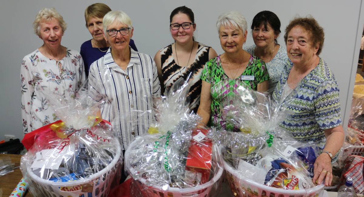 XMAS ELVES: The St Vincent de Paul volunteers have been busy putting toys, food and gifts donated from the Griffith community into hampers for those in need this Christmas. PHOTO: Jacinta Dickins