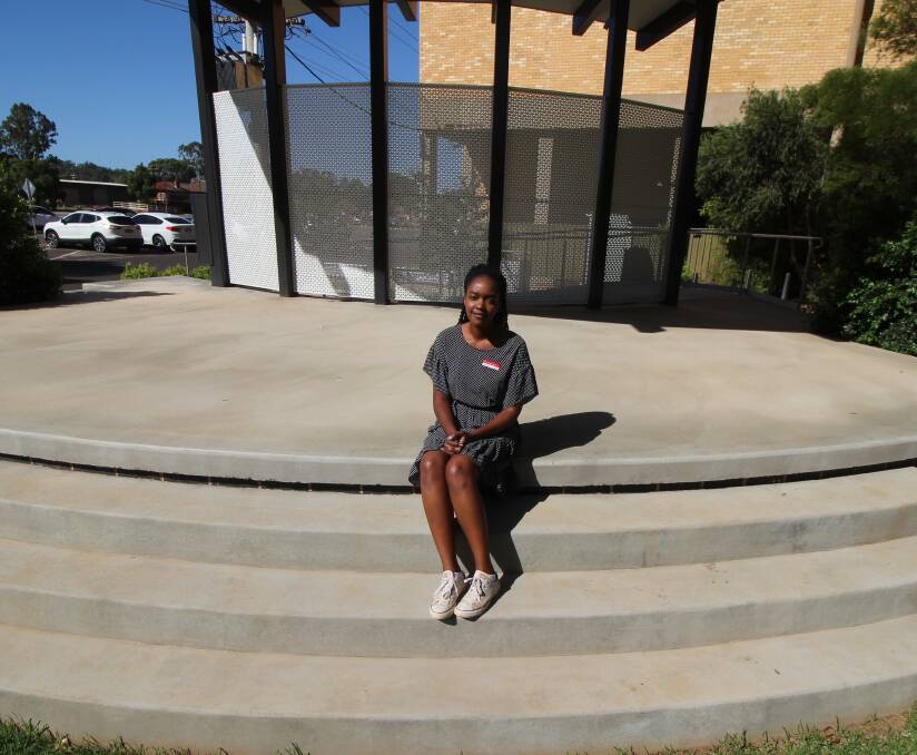 CANCELLED: Oumi Karenga-Hewitt, Western Riverina Arts board member, sits on the now empty stage at Memorial Park. PHOTO: Jacinta Dickins 