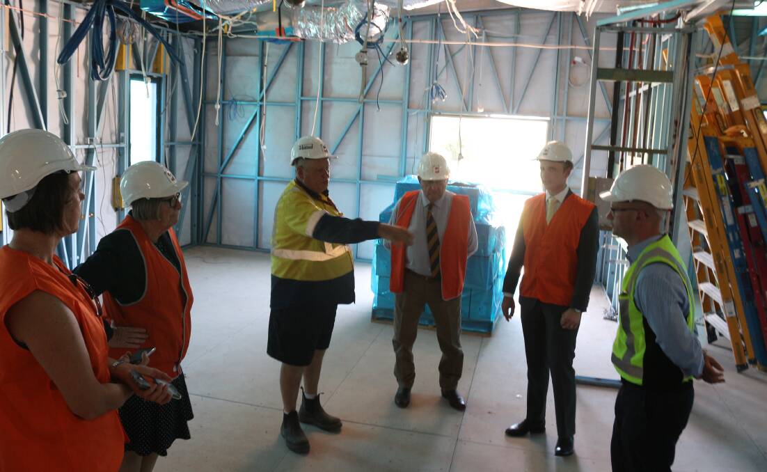 Builders take MLHD and council representatives through the new ambulatory hub. PHOTO: Jacinta Dickins