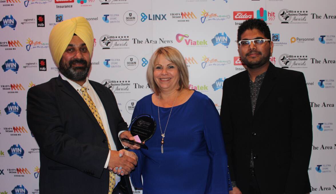REWARDING: Griffith Newsagency owners Manjit Lalli and Pinkal Patel with The Area News sponsor representative Viviana Bellato (centre). PHOTO: Jacinta Dickins