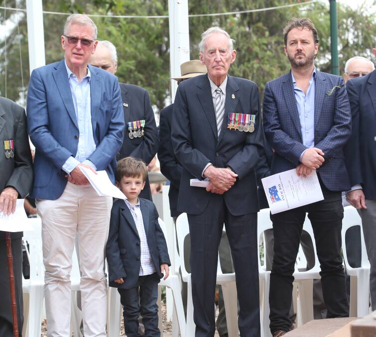 FOUR GENERATIONS: Danny Gilbert, Iggy Pulstinick-Colombres, Reg Gilbert and James Gilbert commemorate Anzac Day together. PHOTO: Anthony Stipo.