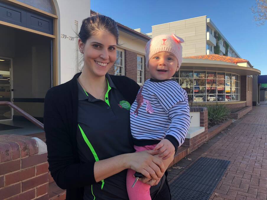 LIBRARY LOVERS: Regular library goers and Baby Bounce devotees Gloria and Natalia Maugeri would hate to see any services cut from the Griffith City Library. PHOTO: Jacinta Dickins.
