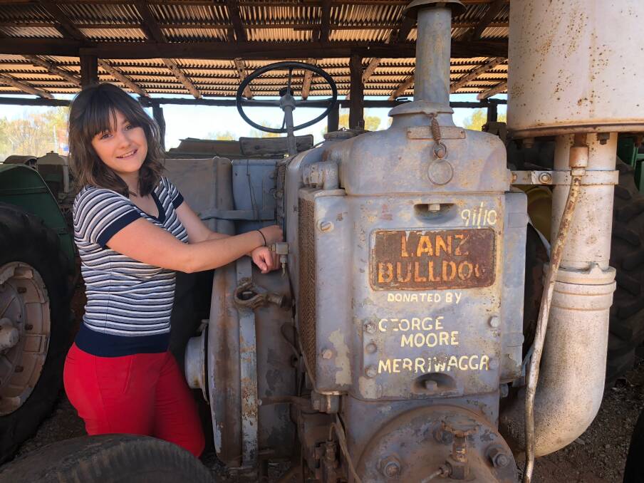 FULL STEAM: Griffith Pioneer Park Museum's curator Bonnie Owen tells of the historical significance of her favourite tractor the Lanz Bulldog, donated by a farmer in Merriwagga. Picture: Jacinta Dickins