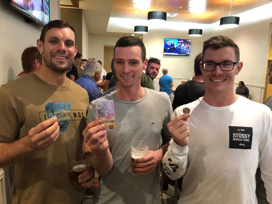 PLAYING THE ODDS: Tim Sellars, James Terrel and Morgan Forster were three of the many testing their luck down at Griffith Ex-Servicemen's Club playing two-up on one of the days the game is allowed in NSW. PHOTO: Jacinta Dickins.