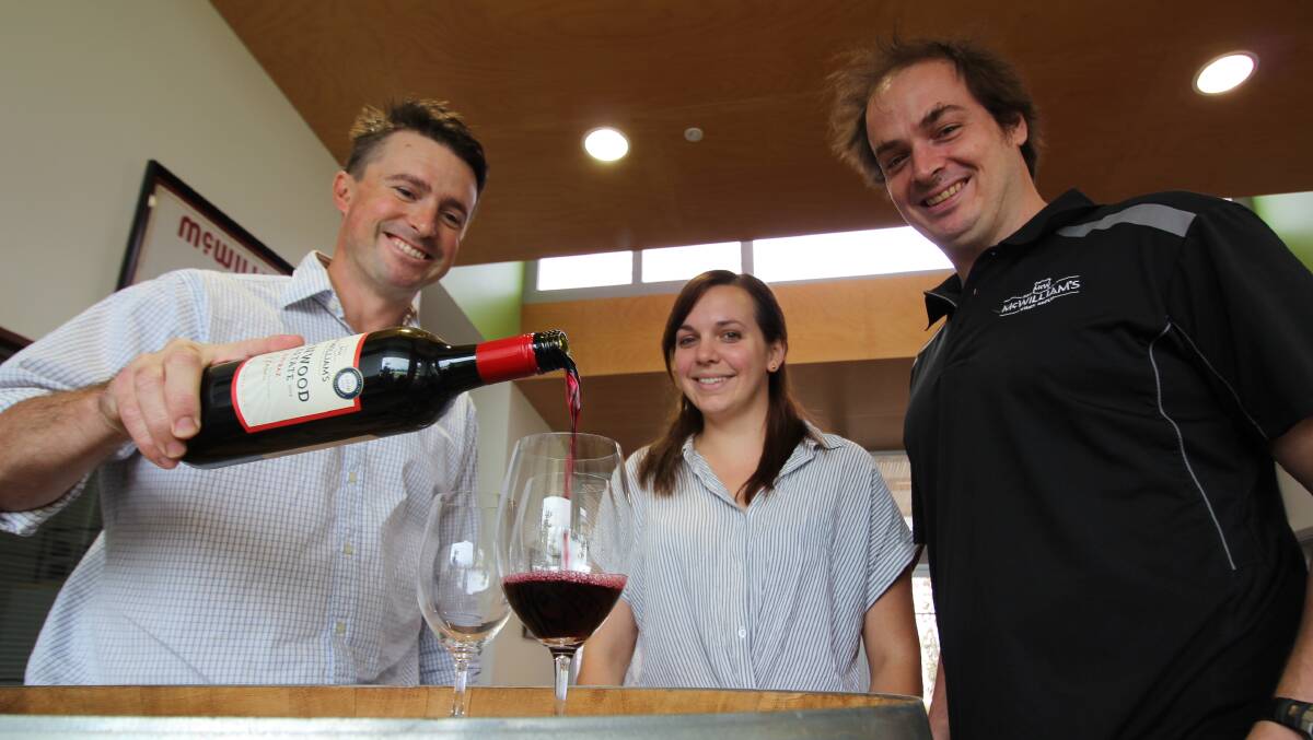 CHEERS TO THAT: McWilliams' chief winemaker Andrew Higgins celebrating their Hanwood Shiraz Estate 2018's wins with fellow winemakers Stephanie Lucas and Harry Kinsman. PHOTO: Jacinta Dickins