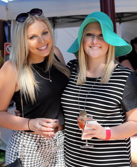 SARAH Cavanagh and Hannah Morris enjoy the atmosphere of last year's La Festa. This year's event returns to the heart of the city, at Memorial Park.