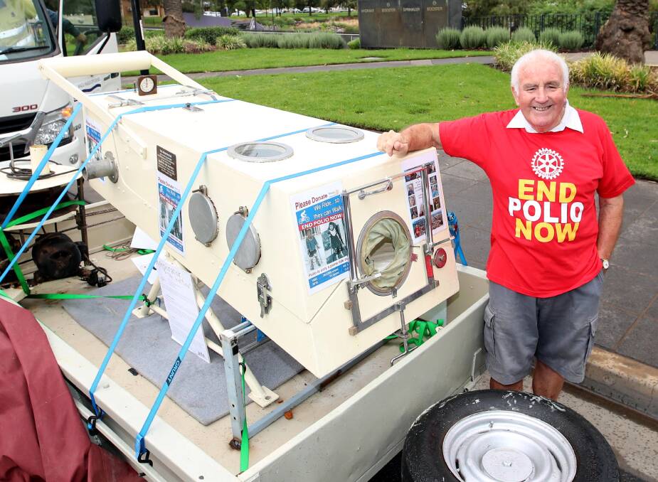 WELL TRAVELLED: Wagga Rotarian Fred Loneragan with “Maggie”, the iron lung that toured District 9700 in the lead up to the district conference. Picture: Les Smith