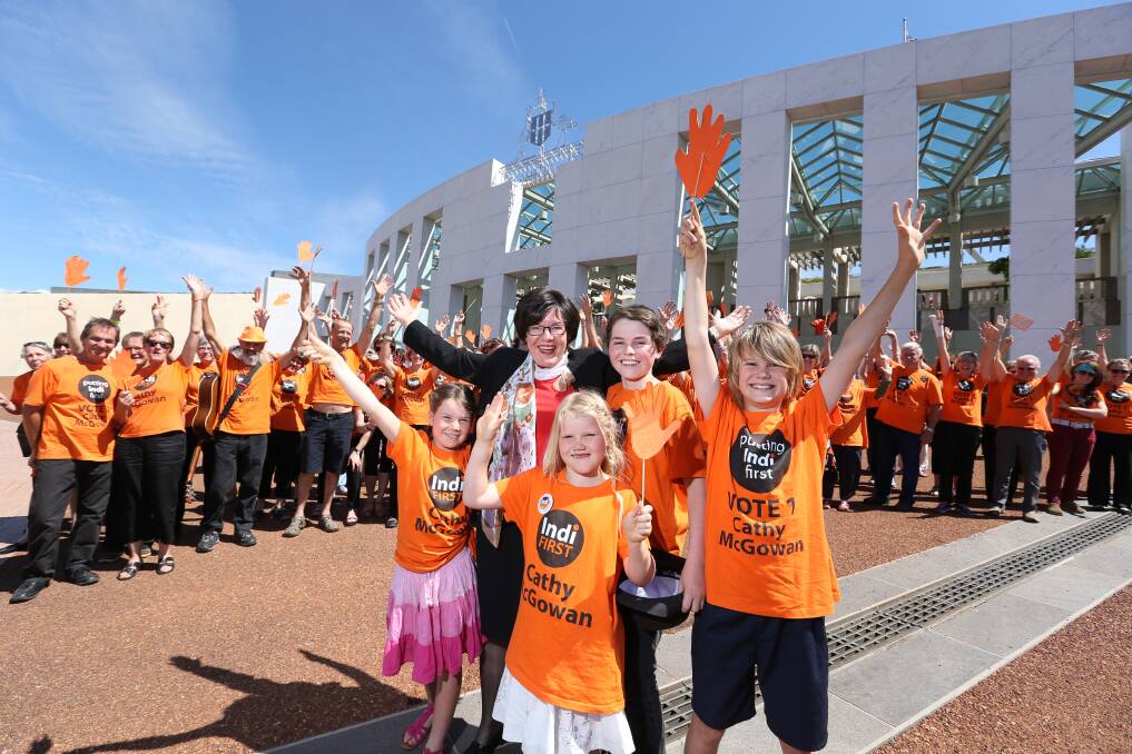THE BEGINNING: Cathy McGowan, her nieces and nephews, and orange supporters arrive in Canberra in 2013.