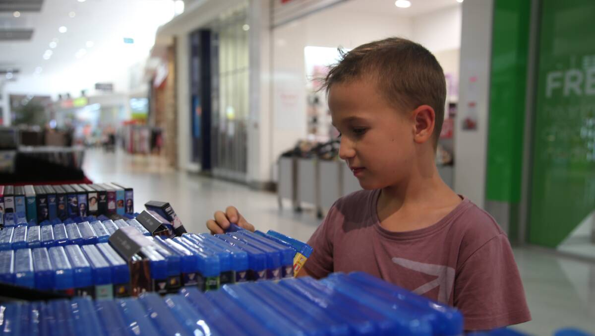 Lane Stewart, aged nine, enjoyed shopping with his family yesterday