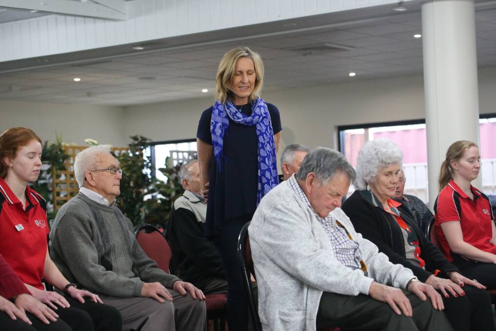 MAKING A DIFFERENCE: Sally Wilcox helping people with breathing exercises to help lessen anxiety. Photo: ANTHONY STIPO