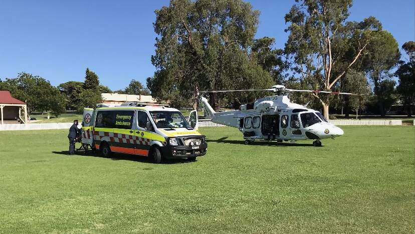 NSW Ambulance paramedics met a rescue helicopter in Narrandera after a crash near Sandigo on Friday. PHOTO: Supplied