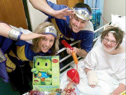2008: Bringing Christmas early to the children’s ward at Griffith Base Hospital
are a pair of Captain Starlights with patient Rachel Gray.
