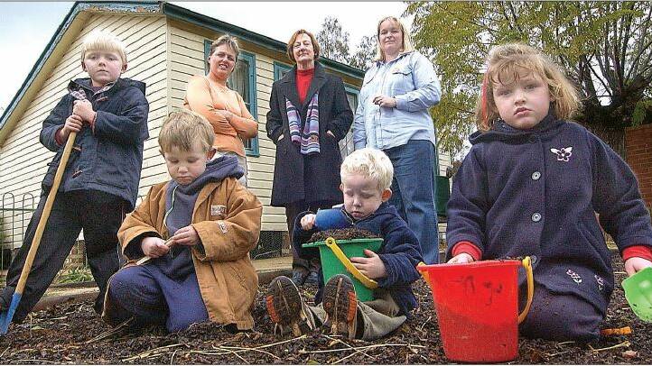 2004: Corey Minchin, Henry Grinter, Tom Semmler, and Sophie Litchfield, all 4, join Ardlethan Pre-school president Reckell Jones, (back, left) assistant Sandra Werner and director Fiona Minchin in pondering the future of the pre-school after recent legislation forced the centre to raise $80,000 to remain open.