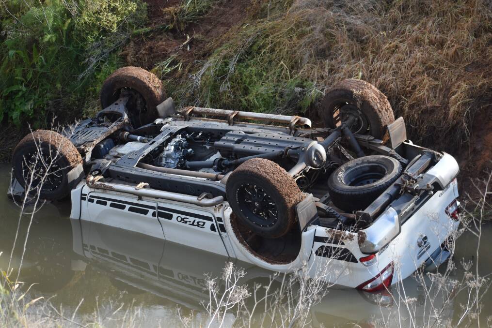 TRAGEDY: Two men were killed in a crash on Mansell Road, with the ute landing in a canal. Picture: Area News