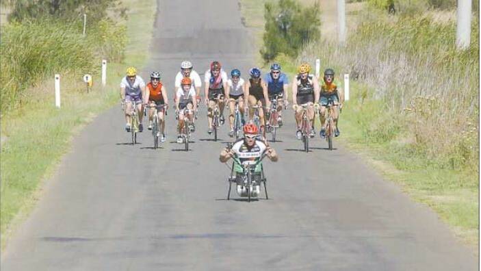 2004: Inspirational athlete John Maclean leads Griffith triathletes on a social training ride at Lake Wyangan on Saturday. Picture: MICHAEL KELLY