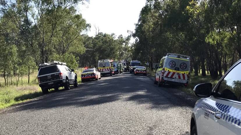HELP IS HERE: Emergency services attend to a single-vehicle crash on Buckingbong Road near Sandigo yesterday morning. PHOTO: Supplied