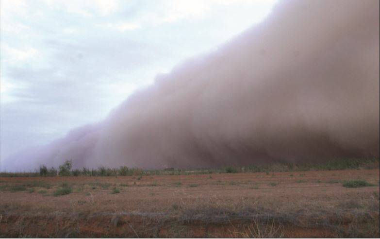2002: The dust storm on Tuesday evening rolled through Griffith and Yenda, bringing a dirty brown virtual nightfall. Picture: CARLA EADE 