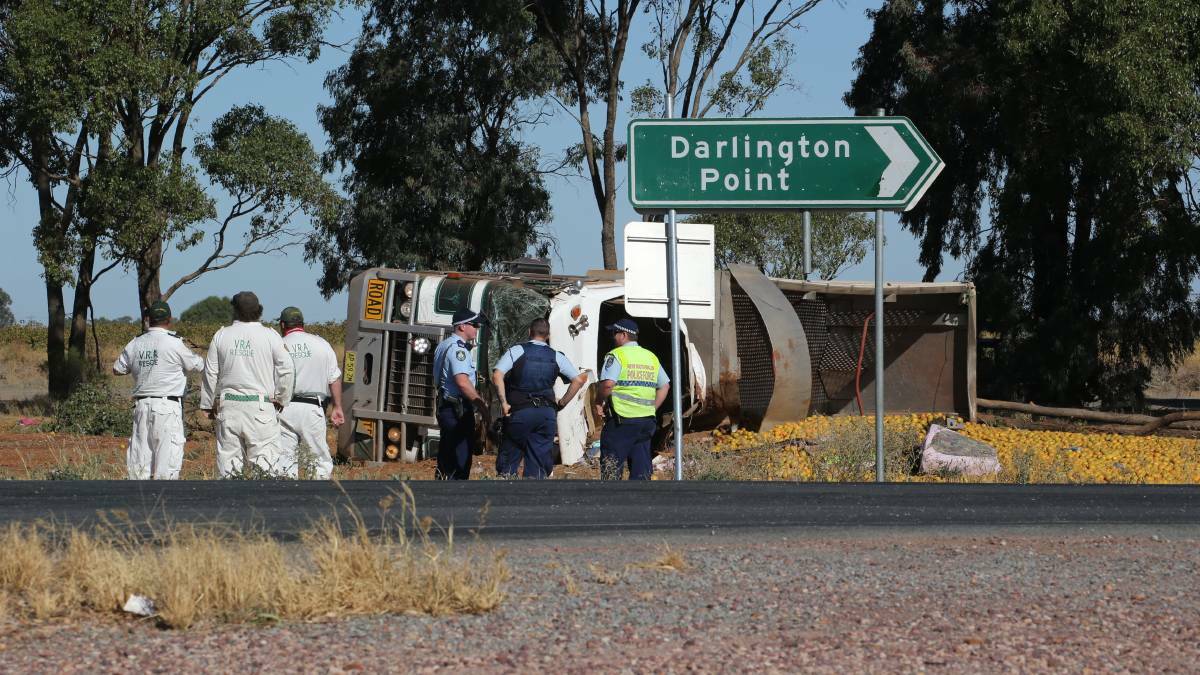 Leeton Volunteer Rescue Association personnel and police at the scene of the Irrigation Way crash that claimed the life of a 63-year-old woman. Picture: The Irrigator