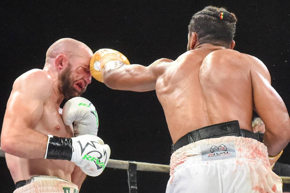 A punch lands as undercard fights lead up to the Michael Zerafa-Anthony Mundine showstopper in Bendigo. Photo: Darren Howe, Bendigo Advertiser