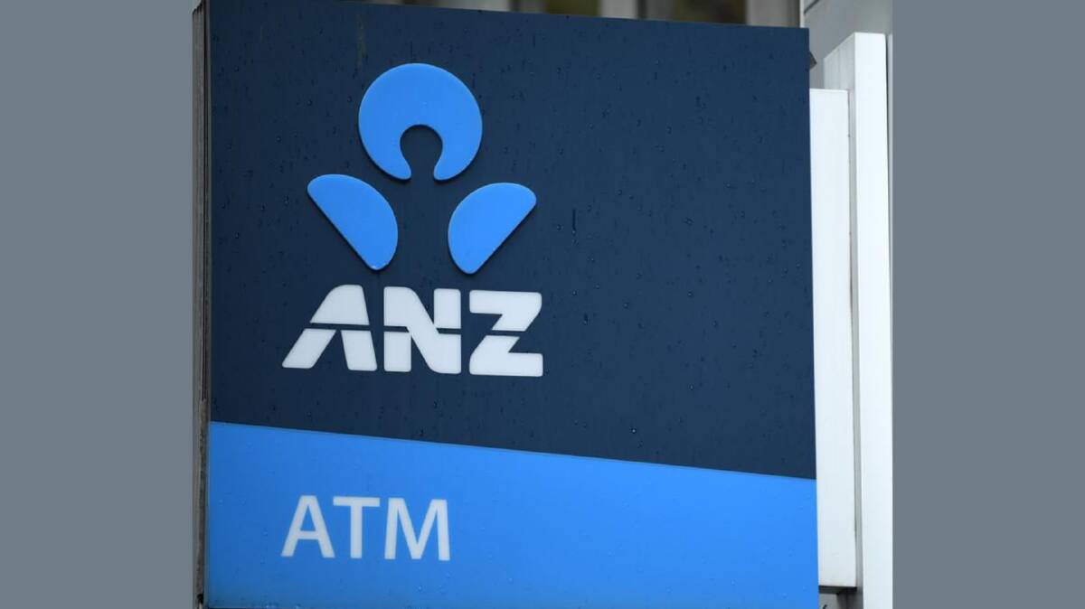 ANZ has reported a big drop in full-year earnings and cut its dividend payout to shareholders.
