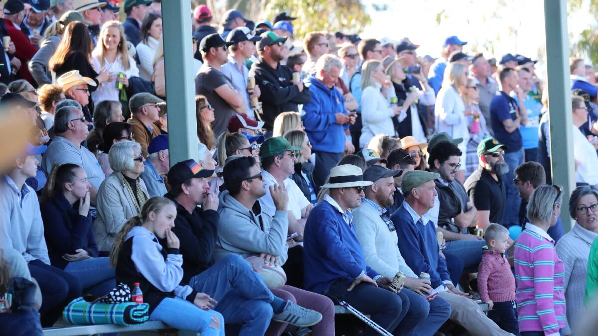 ON THE MOVE: A packed crowd watch as Waratahs downed Ag College in last year's Southern Inland grand final. This year's decider has been moved to avoid a clash with the popular Aggies race day.