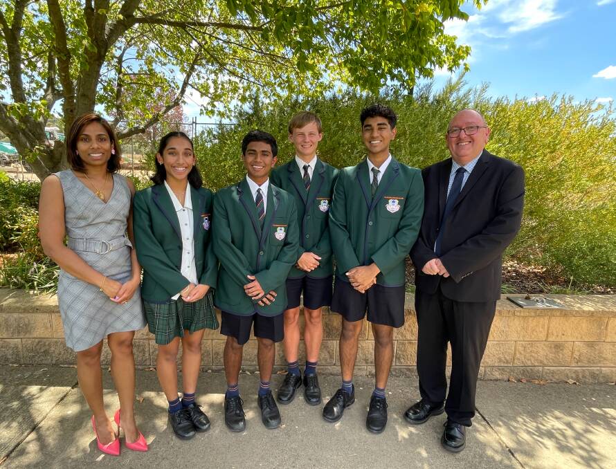 TRAC teacher Diana Ganapathy with year 10 students Quinntesaa Sankr, 15, Hansa Rathnayake, 15, Max Harris, 15 and Jaiden Cherian 15 with principal Craig Mansour. Picture by Taylor Dodge