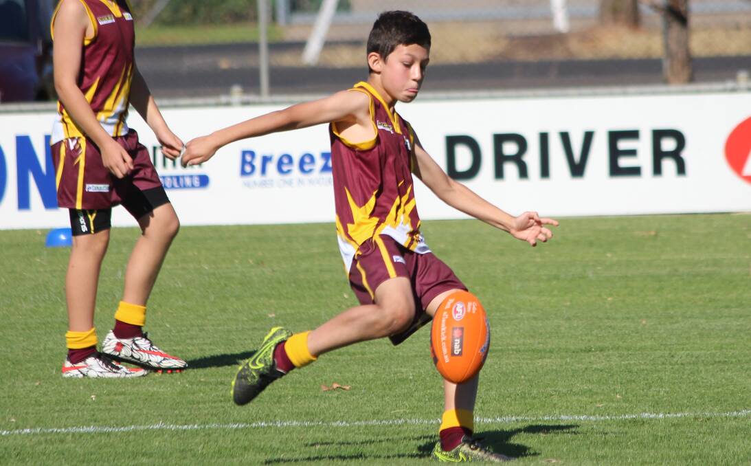 ON TARGET: Benjamin Fattore from Beelbangera Public School launches a shot at goal. Picture: Riley Krause