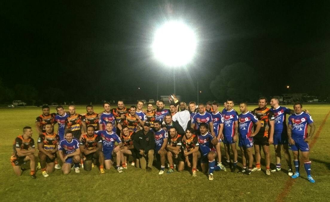 LEAVE IT ON THE FIELD: The Griffith Waratah Tigers and Darlington Point-Coleambally Roosters come together after fighting it out on the field on Saturday. Photo: Ben Jaffrey