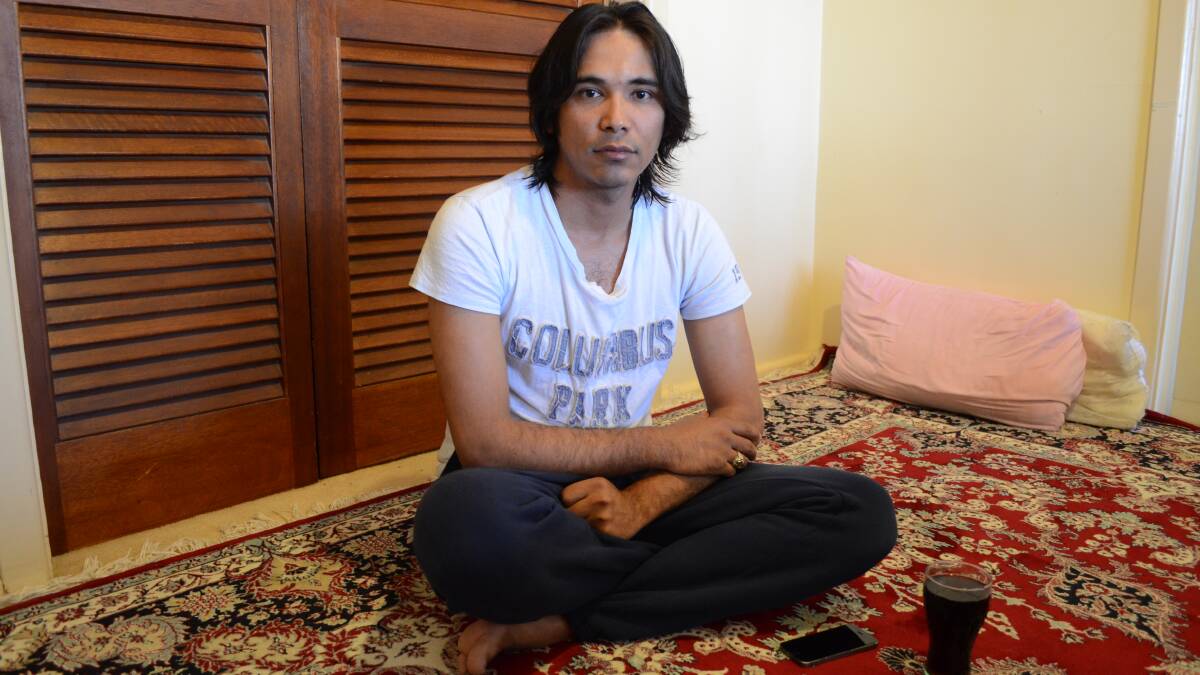 NEW LIFE: Muhammad Hussain sits in his Griffith home. Picture: Ben Jaffrey.