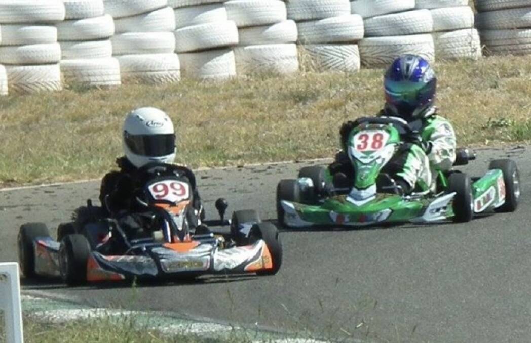 CLOSE BATTLE: William Garner in kart 99 just leads in front of Ky Young in kart 38 in the cadet 12s class. PHOTO: Supplied