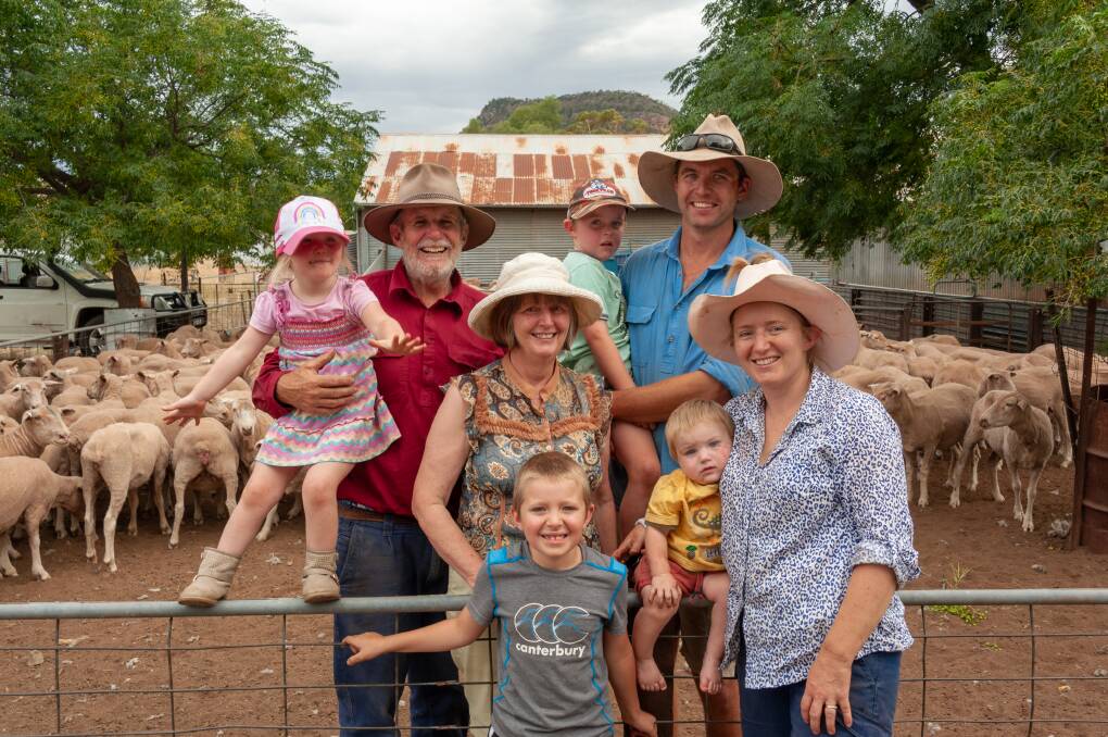 FAMILY BUSINESS: Phil and Alison Lumsden with Joel, Emma, Will, 7, Teddy, 5, Annie, 4, and Jack Sim, 1, on their sheep farm. Picture: Supplied 