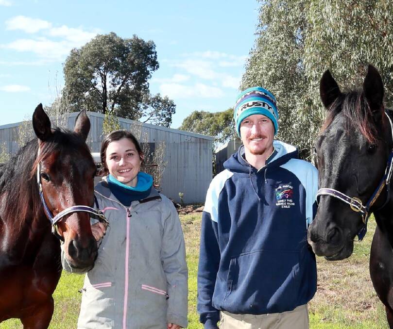 CUP BID: Narrandera trainer Ellen Bartley and driver Blake Jones are chasing a second straight win in the Bidgee Bulk Griffith Cup on Saturday night. (The pair are pictured with Brooklyns Best and Western Sonador). 