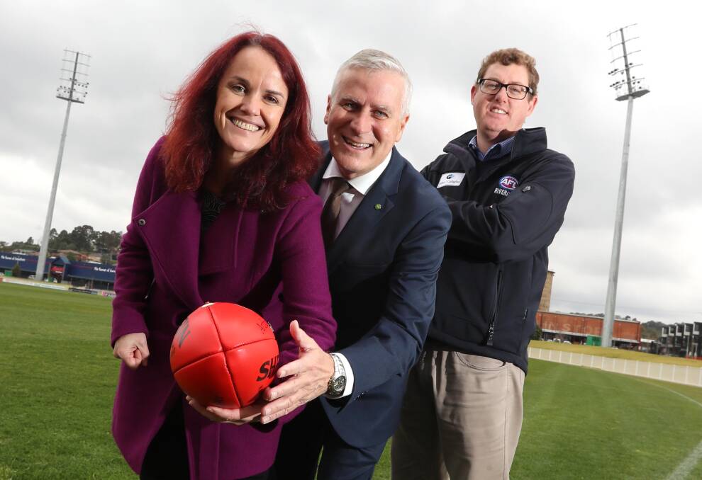 JOINING FORCES: Alcohol and Drug Foundation CEO Erin Lalor with Deputy Prime Minister Michael McCormack and AFL Riverina chairman Michael Irons at Friday's announcement. 