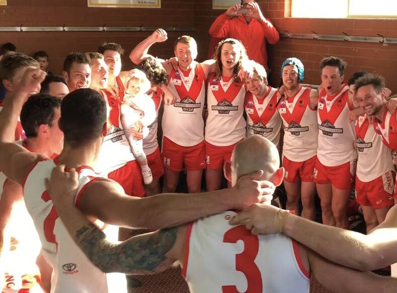 'WE'RE THERE': Brothers Jacob and Lucas Conlan (back, centre) join in the Swans' celebrations after last Sunday's preliminary final victory. 