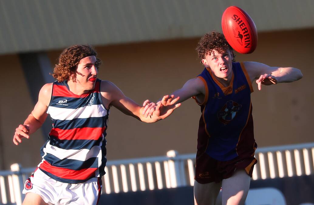 STAR TURN: Jacob Collingridge (left), playing Carroll Cup last year. His Farrer League debut was a stunning one, finishing with six goals for CSU. 