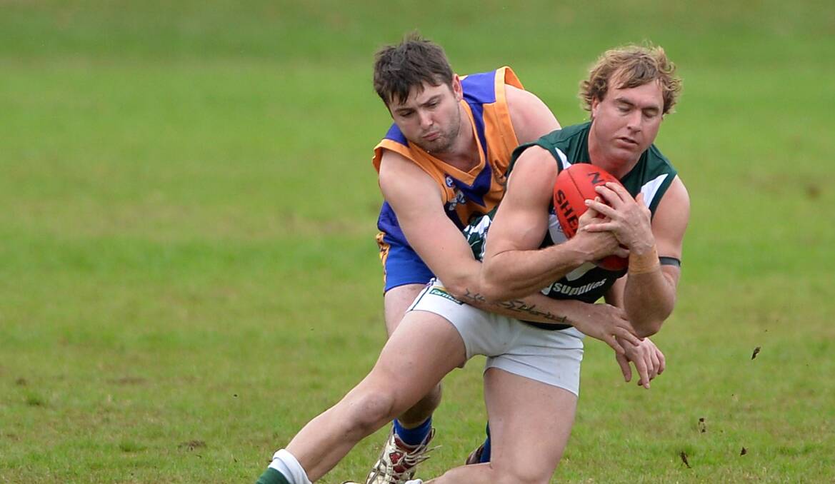 EAGLE LANDS: Former Narrandera full-back Luke Patterson in a contest with Coolamon's Ben Fixter a few seasons ago.