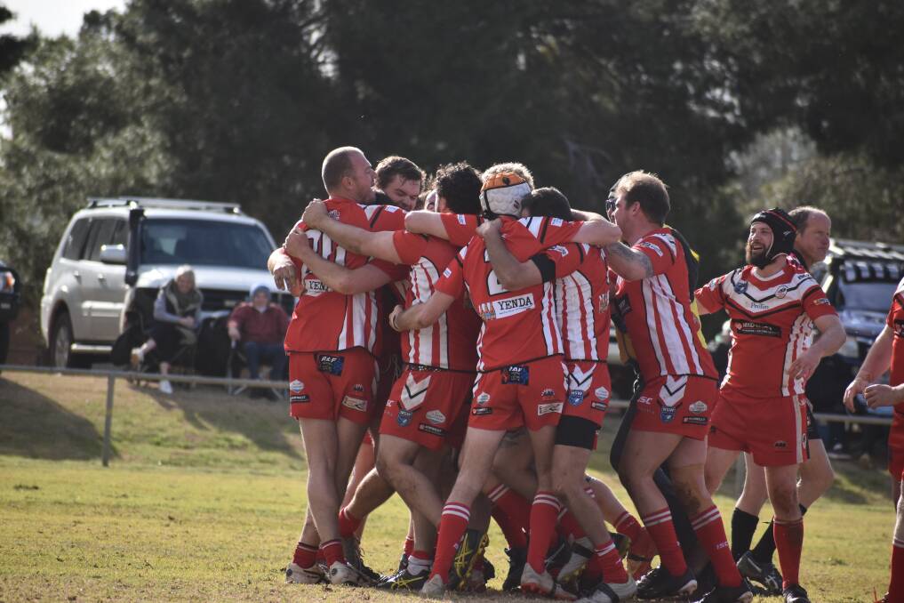 CELEBRATION: Rankins Springs embrace kicker Damien Walker after he kept their hunt for silverware breathing after a nail-biting semi final against Hillston with a golden point penalty goal. PHOTO: Liam Warren